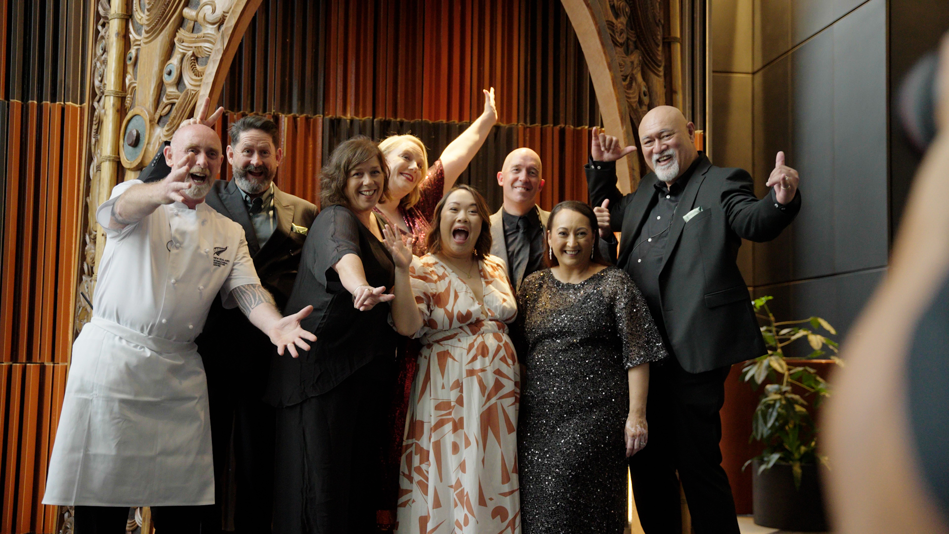 People celebrating while having their photo taken.